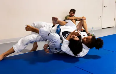 Kids Jiu-Jitsu sparring on blue mats — youth training at Bastos BJJ Midland Texas