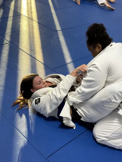 Women's Jiu-Jitsu training session at Bastos BJJ Midland — female athletes sparring on the mats