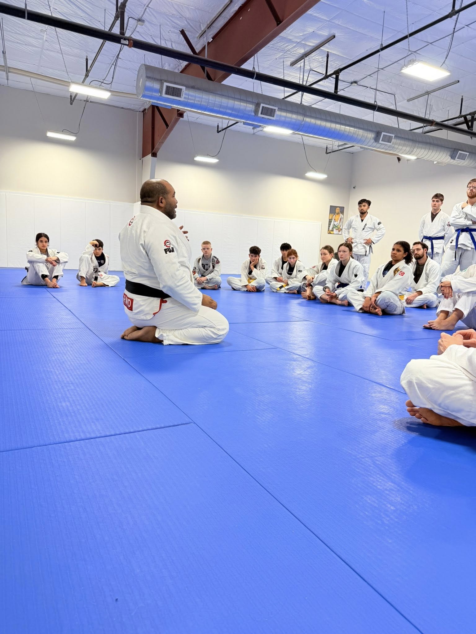 Coach Bruno Bastos teaching technique at Bastos BJJ Midland